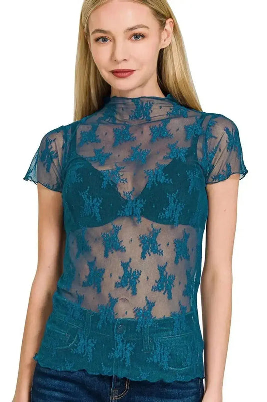 Woman wearing teal lace see-through short sleeve top for layering