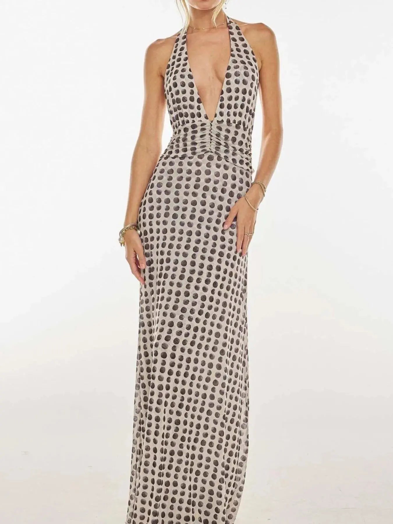 Floral Maxi Dress with Halter Neck and Deep V Design.