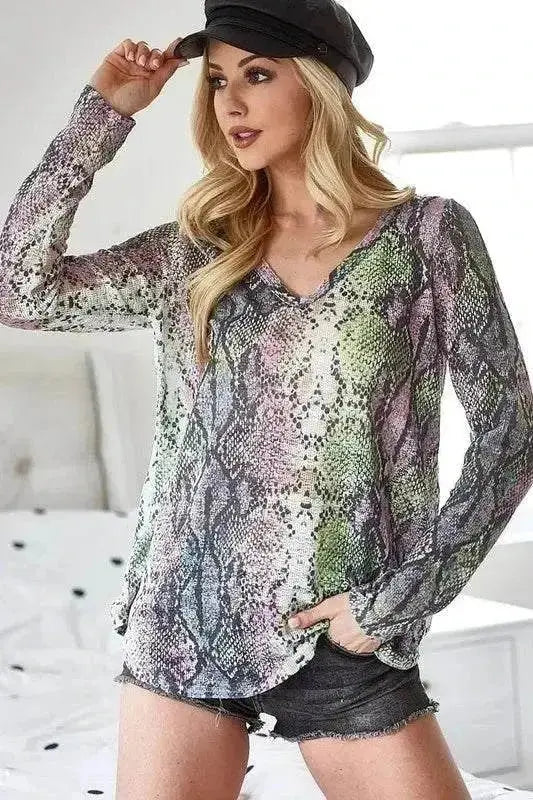 BiBi Snakeskin Print low gauge Hacci V-neck top in soft polyester with a stylish snakeskin pattern and slight stretch.