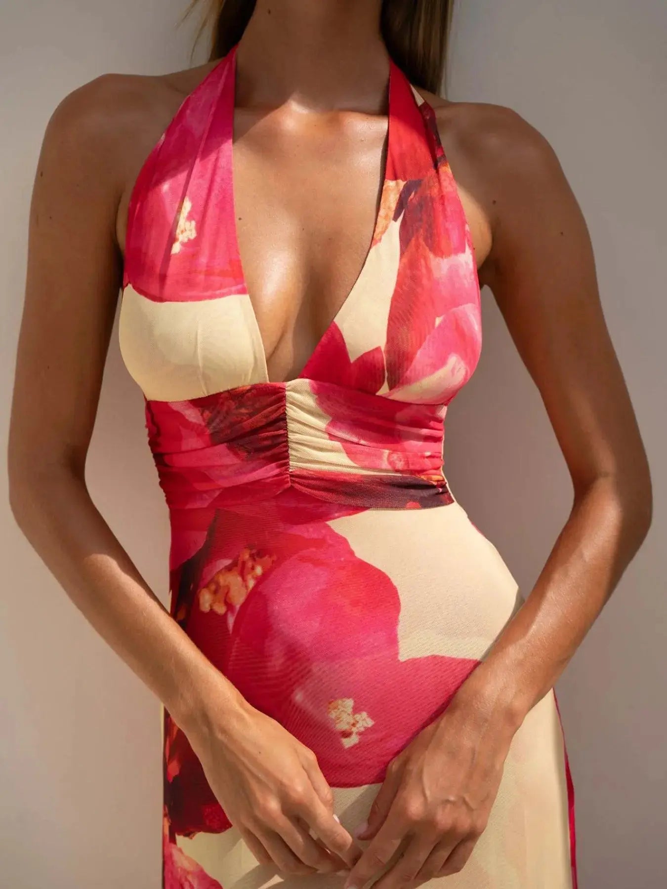 Floral Maxi Dress with Halter Neck and Deep V Design.